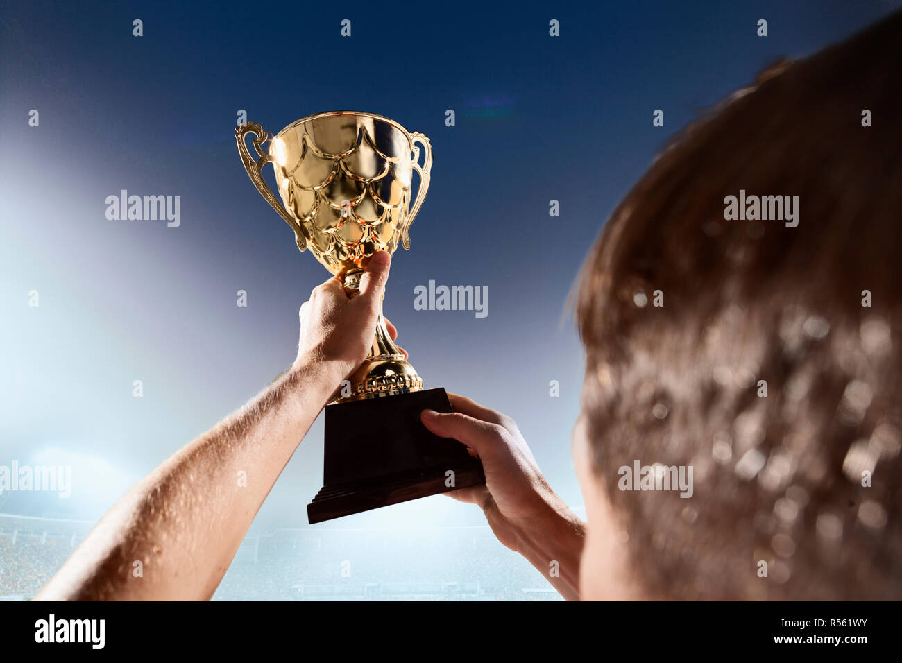 Athlete holding trophy cup Stock Photo Alamy