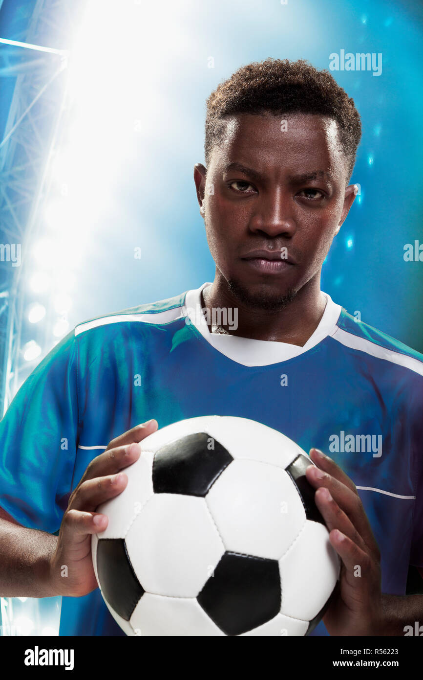 Athlete with soccer ball Stock Photo