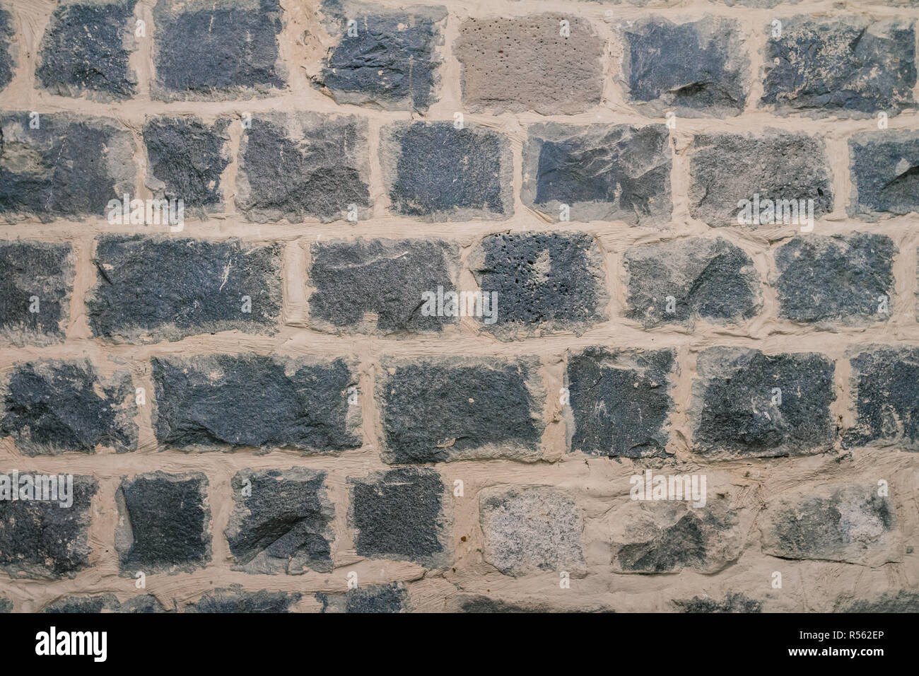 Texture of black basalt brick wall Stock Photo