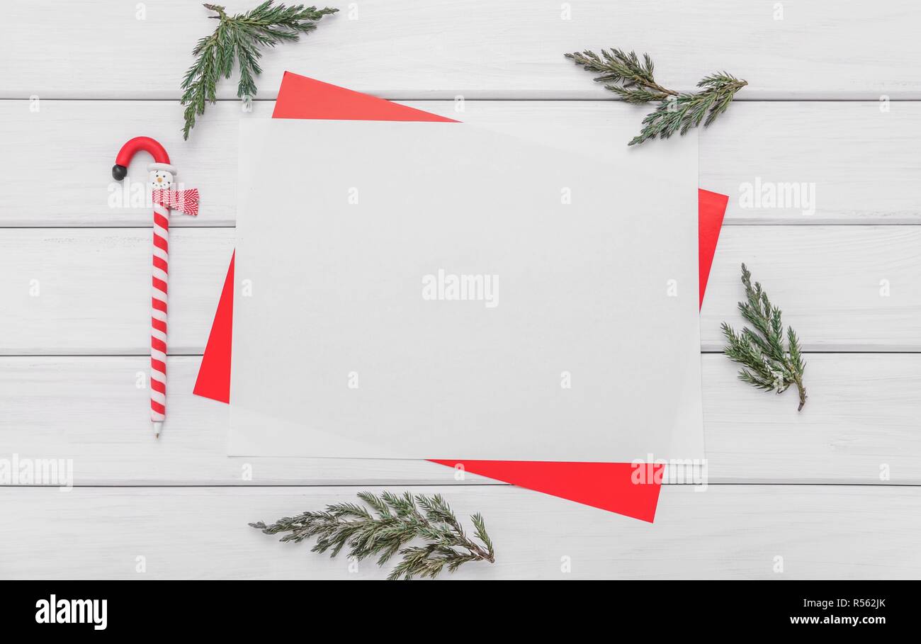 White sheet in a red frame. Preparation for the holiday greetings. Stock Photo
