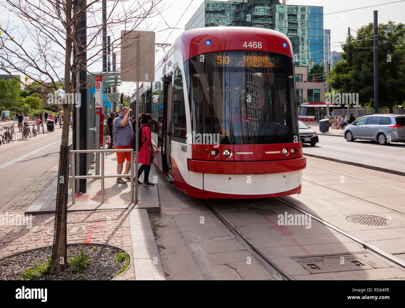 A Flexity Outlook streetcar (number 4468) part of the Spadina line of the TTC (Toronto Transit Commission) running along Queens Quay W. City of Toront Stock Photo