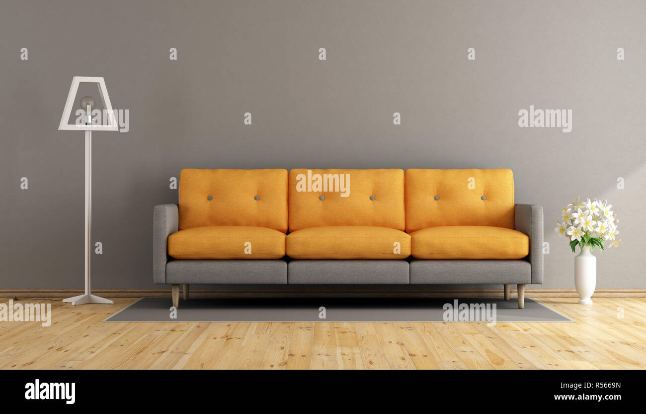 Gray and orange living room Stock Photo - Alamy