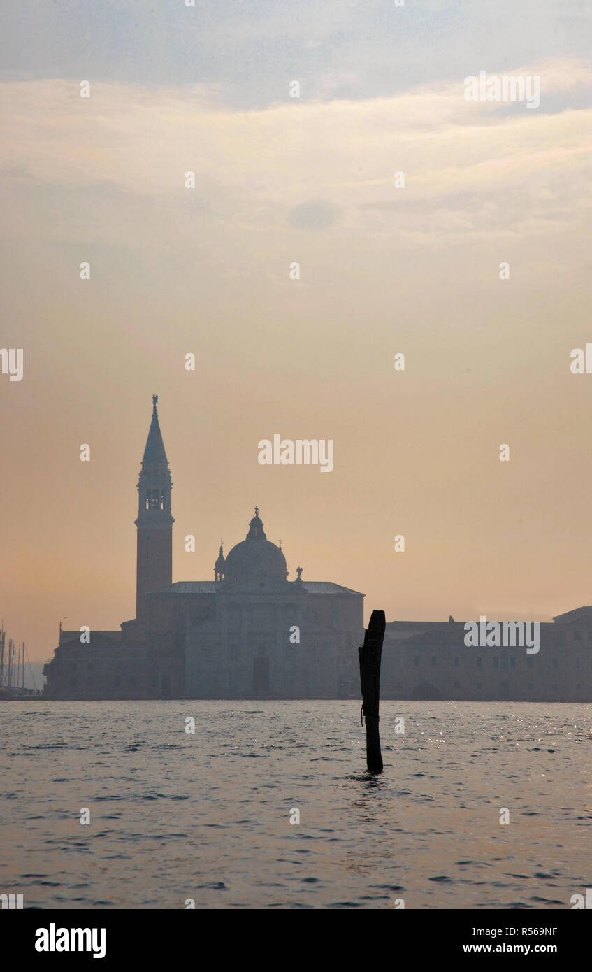 Chiesa di San Giorgio Maggiore, Venice, Italy, across the Basin of St. Mark from the entrance to the Grand Canal in the early morning mist Stock Photo