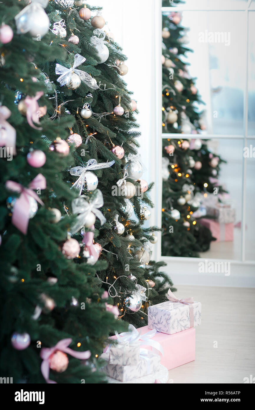 various gifts under beautiful Christmas trees Stock Photo