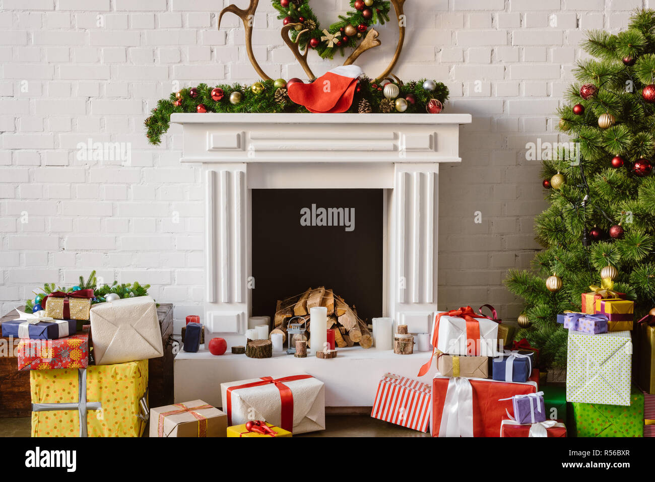 Festive Decorations Over Fireplace With Gift Boxes And Christmas