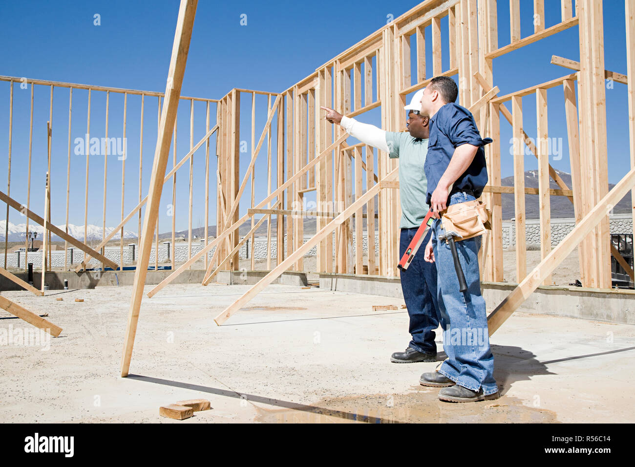 Builders on construction site Stock Photo