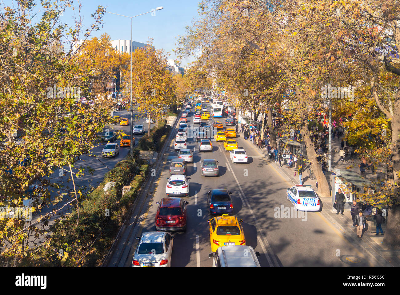 Ankara/Turkey-November 24 2018: Traffic on Ataturk boulevard from Bakanliklar to Kizilay direction. People waiting bus in bus stop during the street. Stock Photo