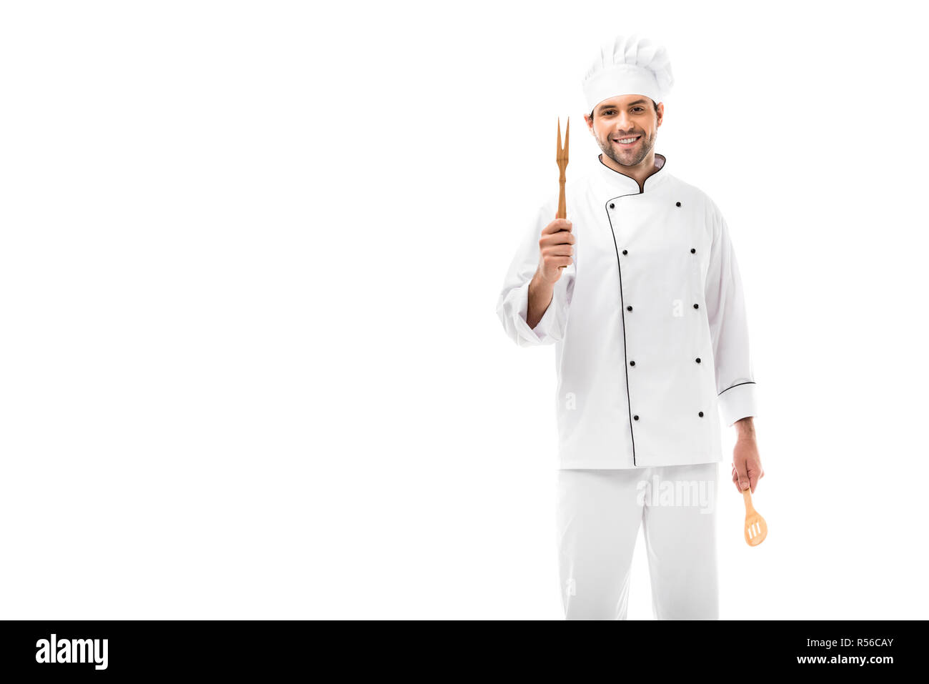 https://c8.alamy.com/comp/R56CAY/happy-young-chef-holding-kitchen-utensils-and-looking-at-camera-isolated-on-white-R56CAY.jpg