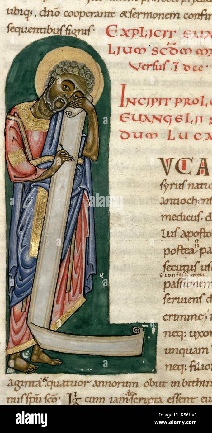 Incipit to St Luke's prologue. Initial 'L', St Luke writing on a scroll. Stavelot Bible. S. Netherlands [Stavelot]; between 1094 and 1097. Source: Add. 28107, f.161v. Language: Latin. Author: Godderanus. Ernesto. Stock Photo
