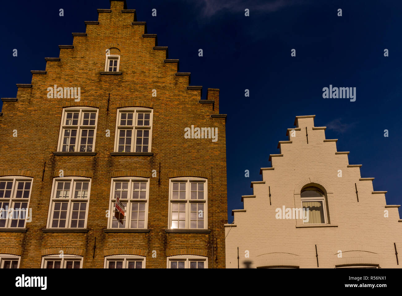 Bruges, Belgium - 17 February 2018: Gable on top of a red brick building at Bruges Stock Photo