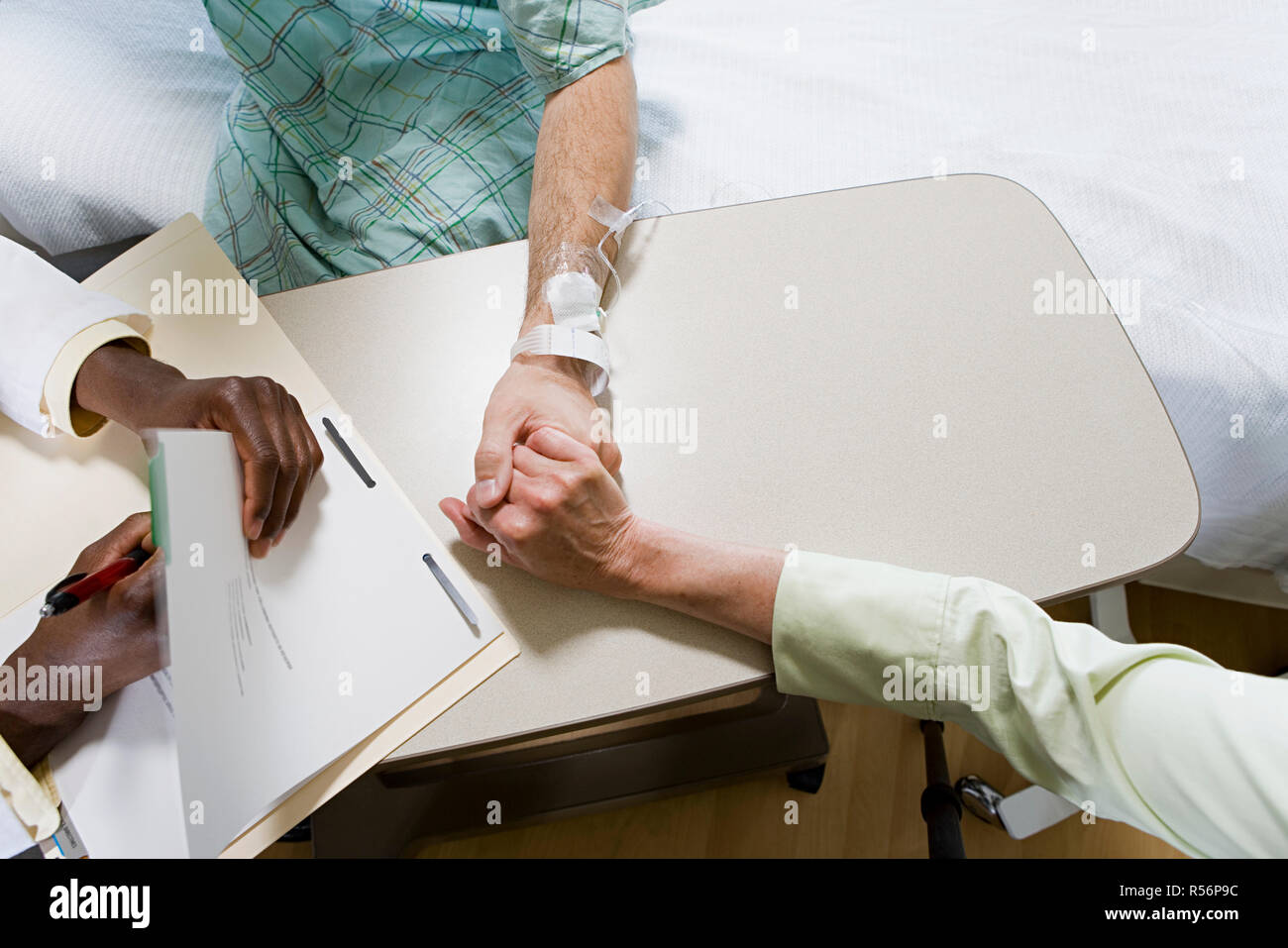 Patient with doctor and relative Stock Photo