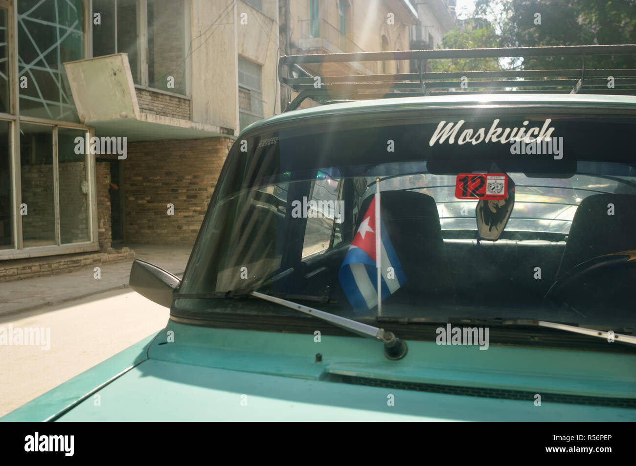 Old classic green Soviet car parked on a street in Havana, Cuba Stock Photo