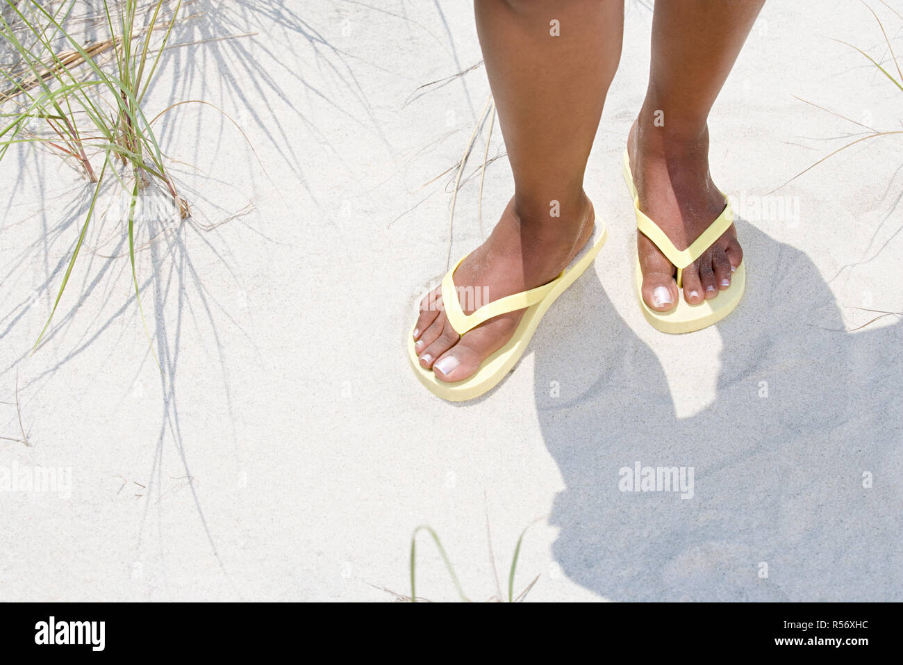 Woman wearing flip flops Stock Photo - Alamy