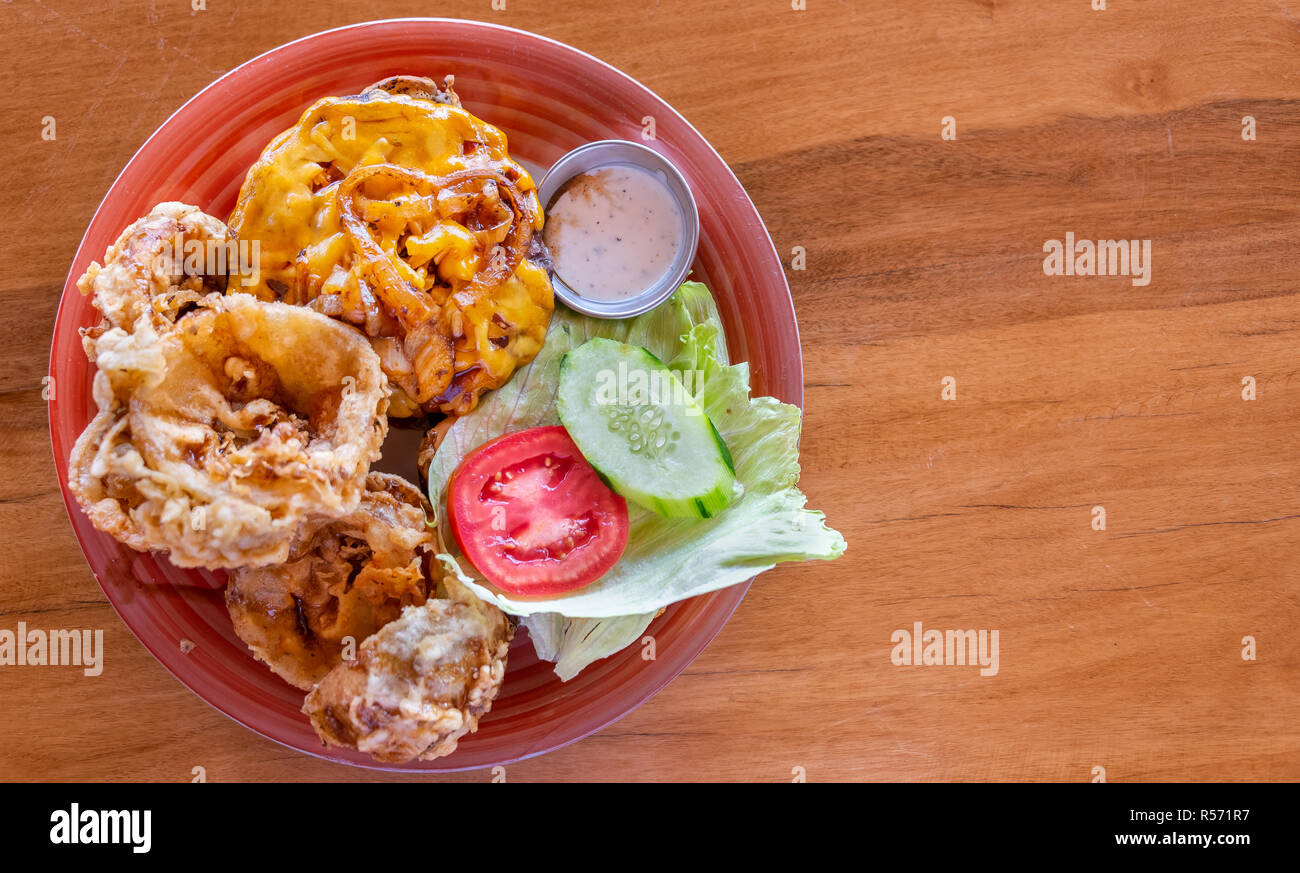 Cheeseburger with handmade onion rings Stock Photo