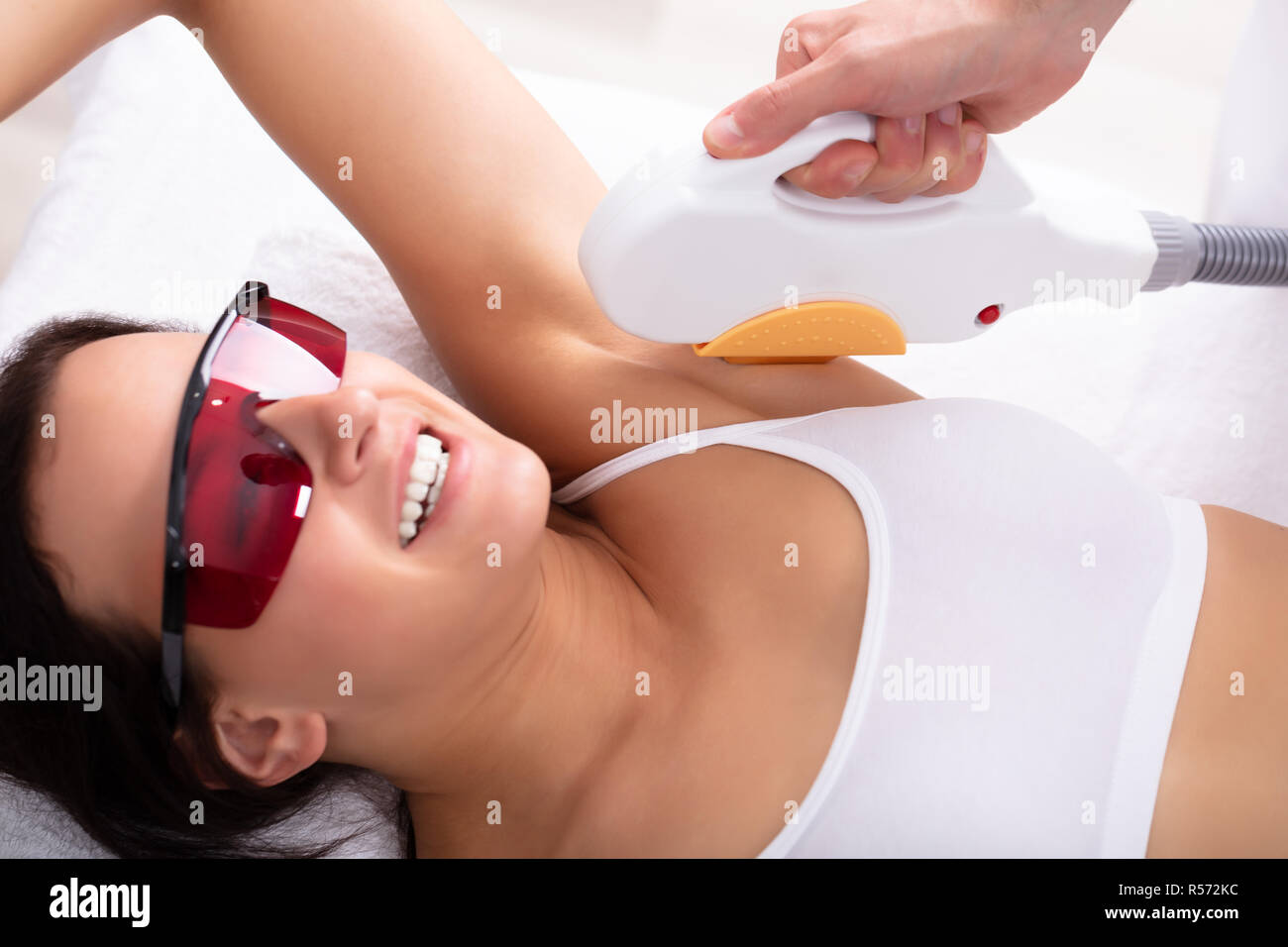 Beautiful Young Woman Having Underarm Laser Hair Removal Treatment In Spa Stock Photo Alamy