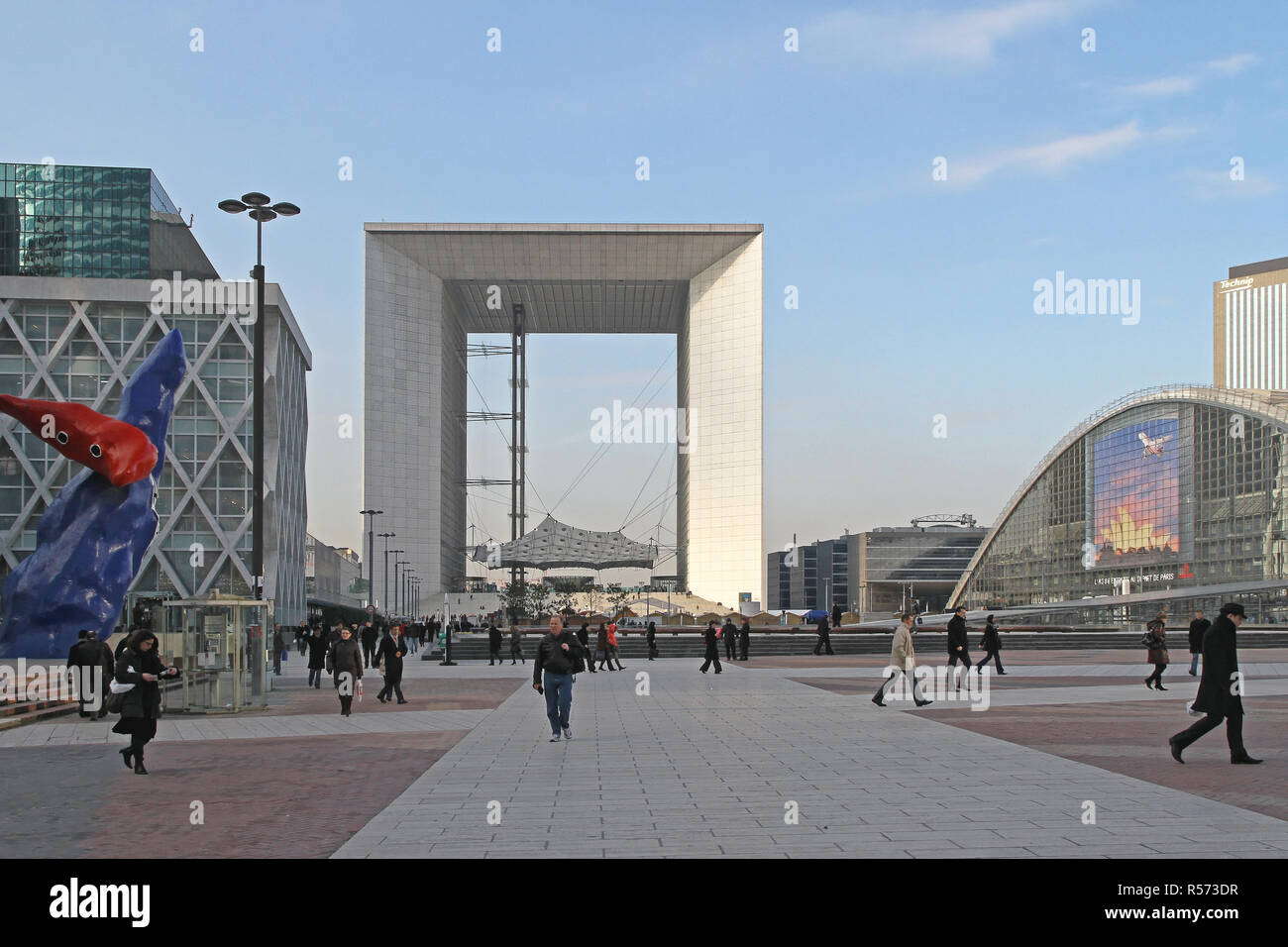 PARIS, FRANCE - JANUARY 05: Grande Arche in Paris on JANUARY 05, 2010. People Walking at the Plaza at La Defense Business District and Grande Arche in Stock Photo