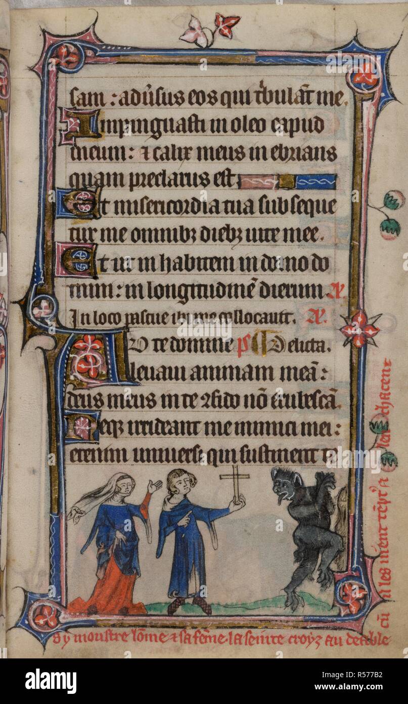 Bas-de-page scene of a husband holding up a cross, while two devils flee before his wife, with a caption reading, â€˜Cy monster lo[m]me et sa fe[m]me la seinte croyz au deable cu[m] il les vient te[m]pt[er] et lenchacentâ€™ . Book of Hours, Use of Sarum ('The Taymouth Hours'). England, S. E.? (London?); 2nd quarter of the 14th century. Source: Yates Thompson 13, f.166. Language: Latin and French. Stock Photo