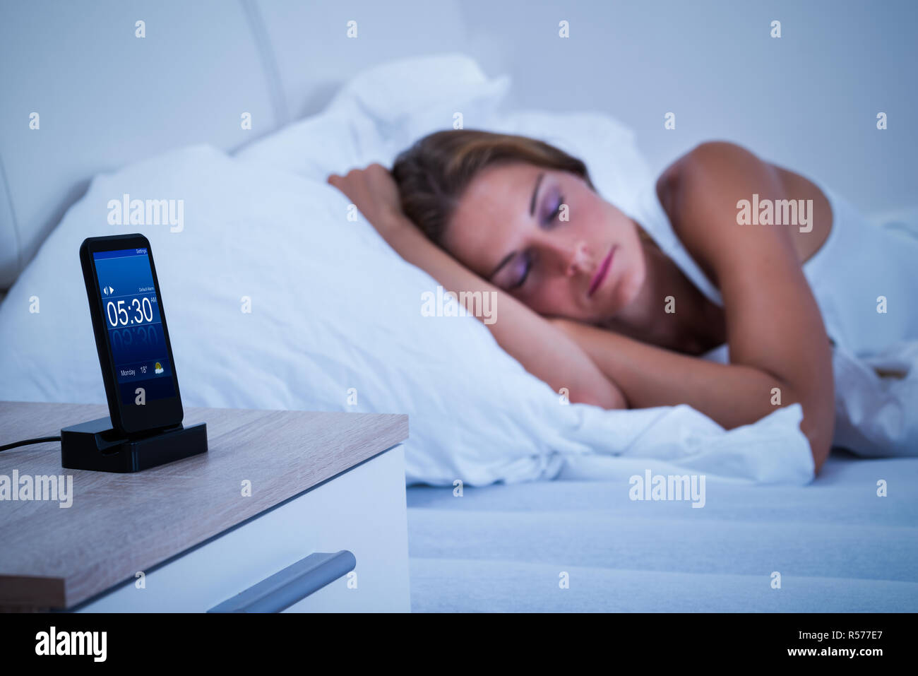 Woman asleep bed digital alarm hires stock photography and images Alamy