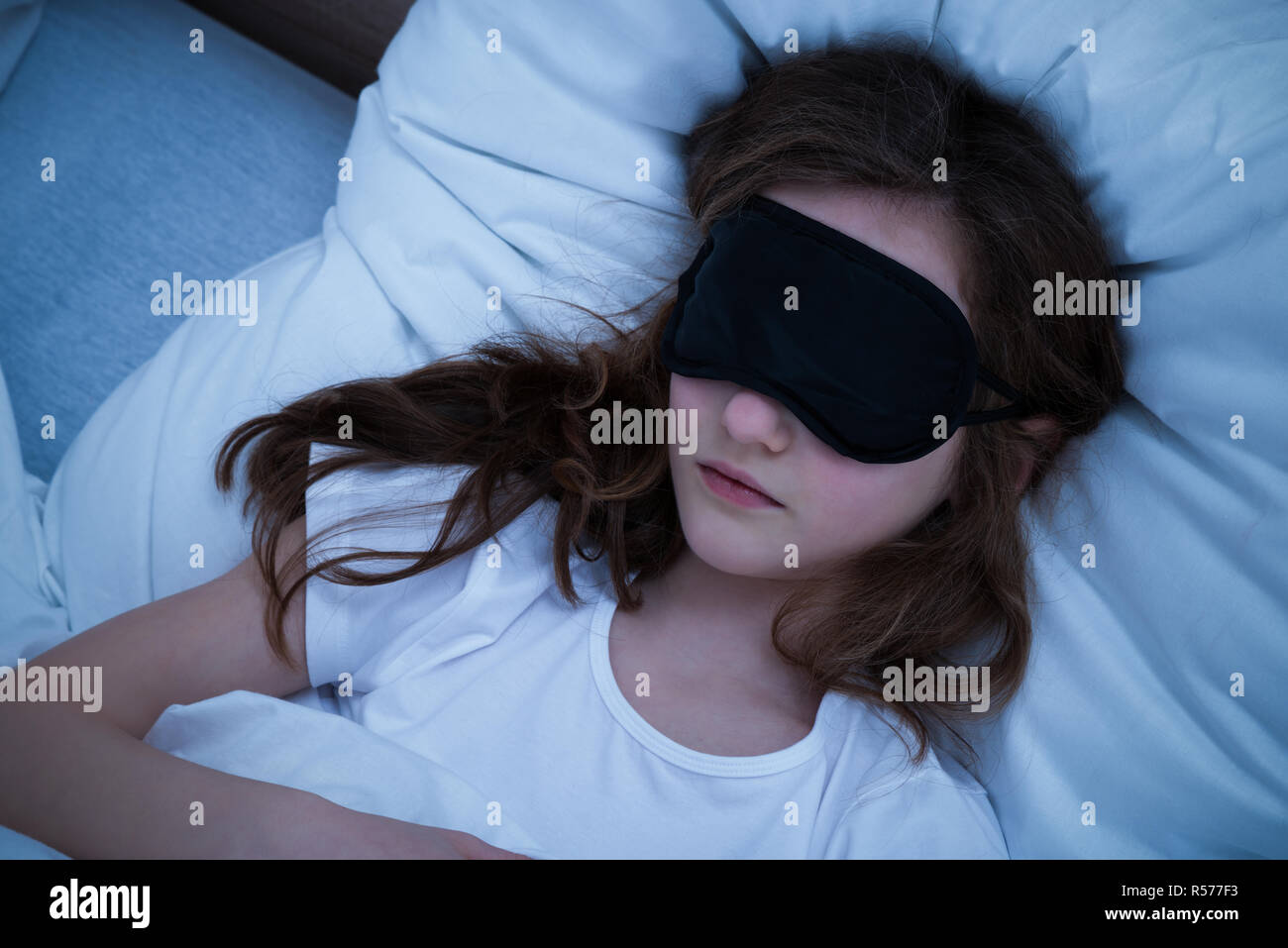 Girl Sleeping With Eye Mask Stock Photo Alamy