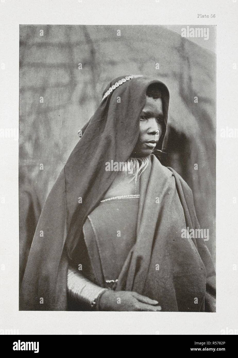 A Bomvana bride.  Her arm is covered from the wrist to the elbow with large solid brass bracelets. The Essential Kafir ... With one hundred full-page illustrations by the author. London : Adam & Charles Black, 1904. Source: 10096.h.20 plate 56. Author: Kidd, Dudley. Stock Photo