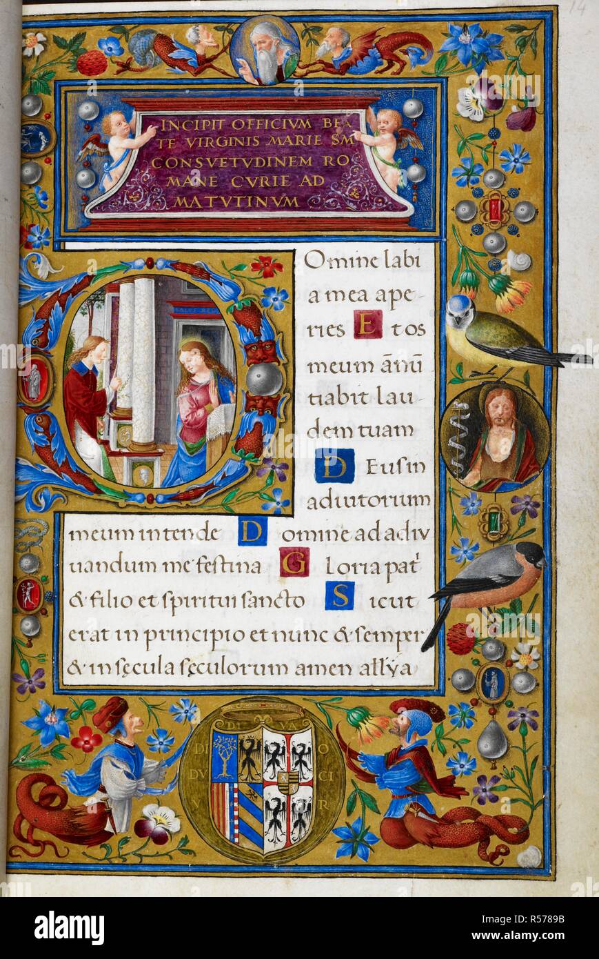 Historiated initial 'D'(omine) with the Annunciation, and a scatter border  with gems, flowers, strawberries, grotesques, heraldry and a blue tit and  bullfinch, a roundel containing John the Baptist, and putti holding the