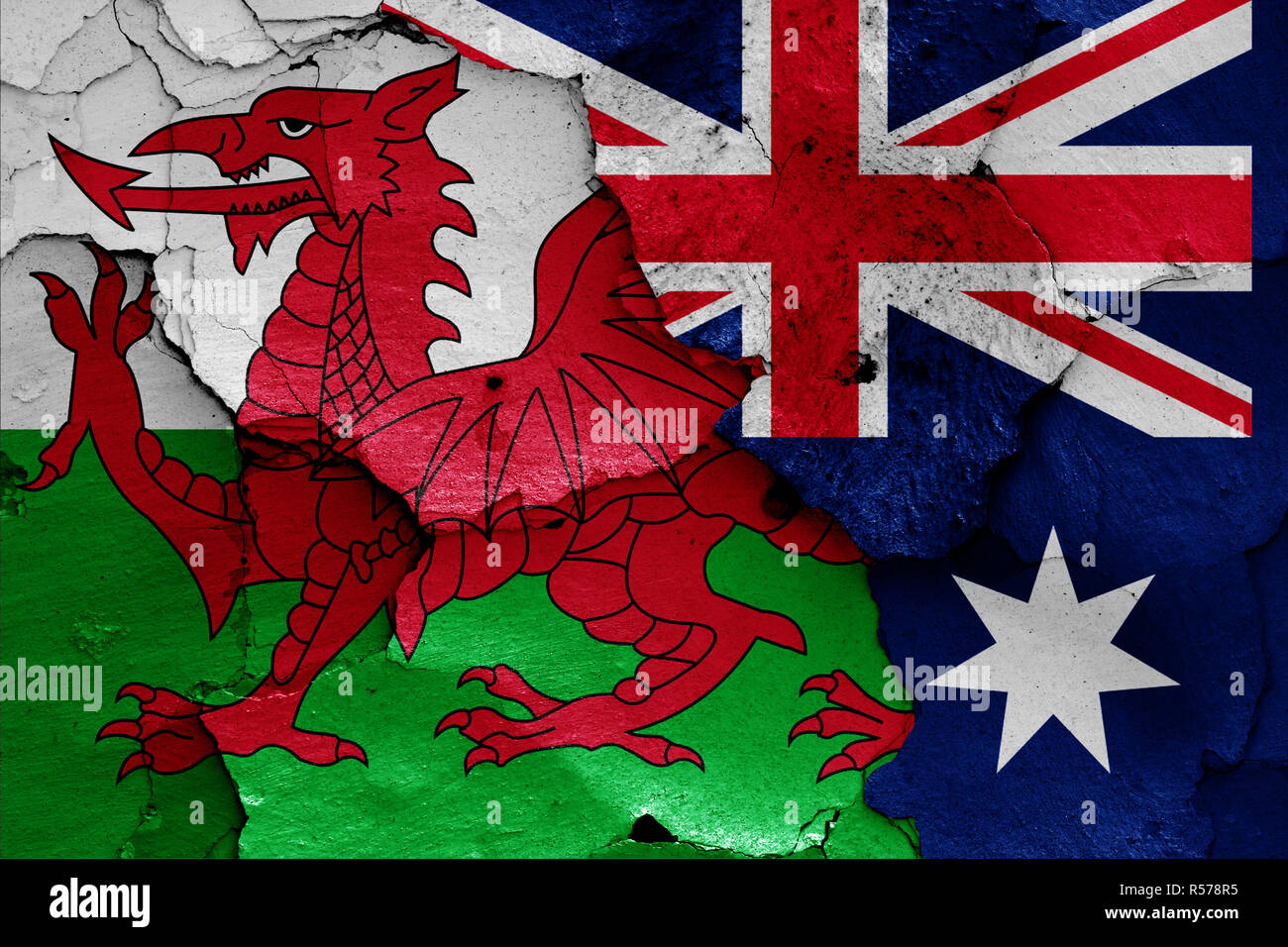 flags of Wales and Australia painted on cracked wall Stock Photo