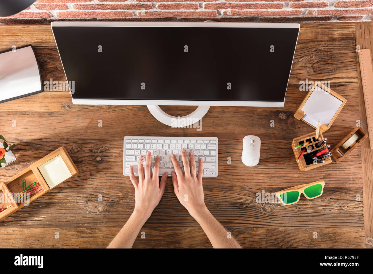 Person Working On Office Desk Stock Photo