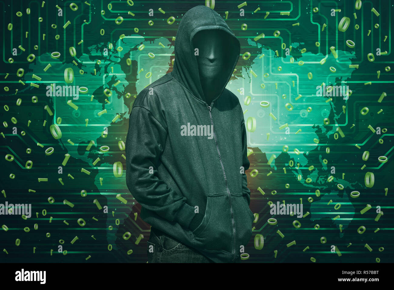 Hooded hacker with anonymous mask standing Stock Photo