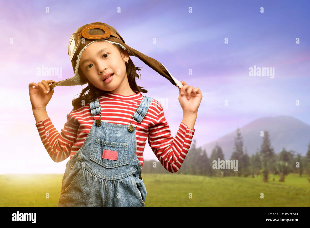 Happy asian kid with goggles and aviator cap having fun Stock Photo Alamy