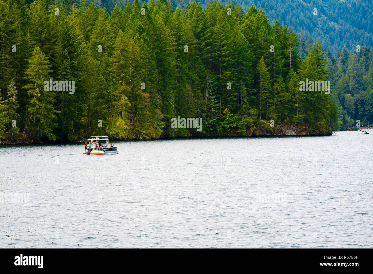 Picturesque mountain clear water deep Merwin Lake with evergreen