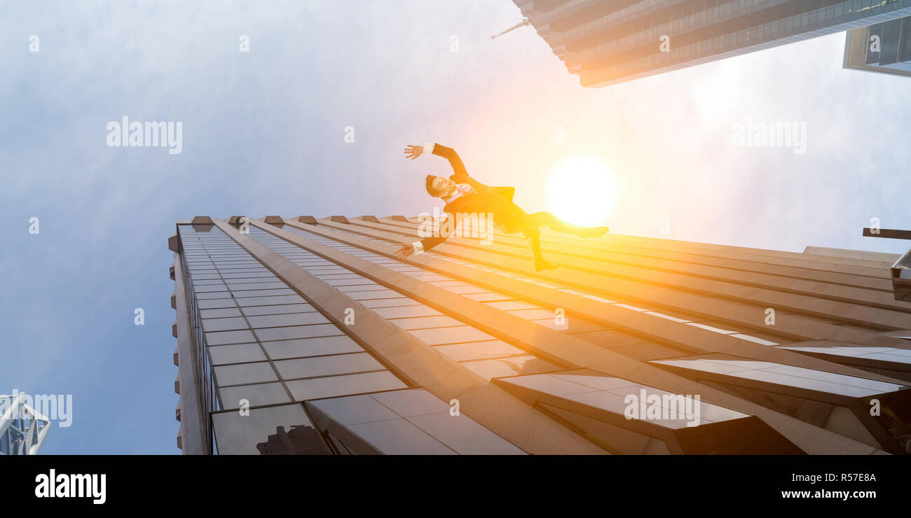 Businessman committing suicide. Mixed media Stock Photo