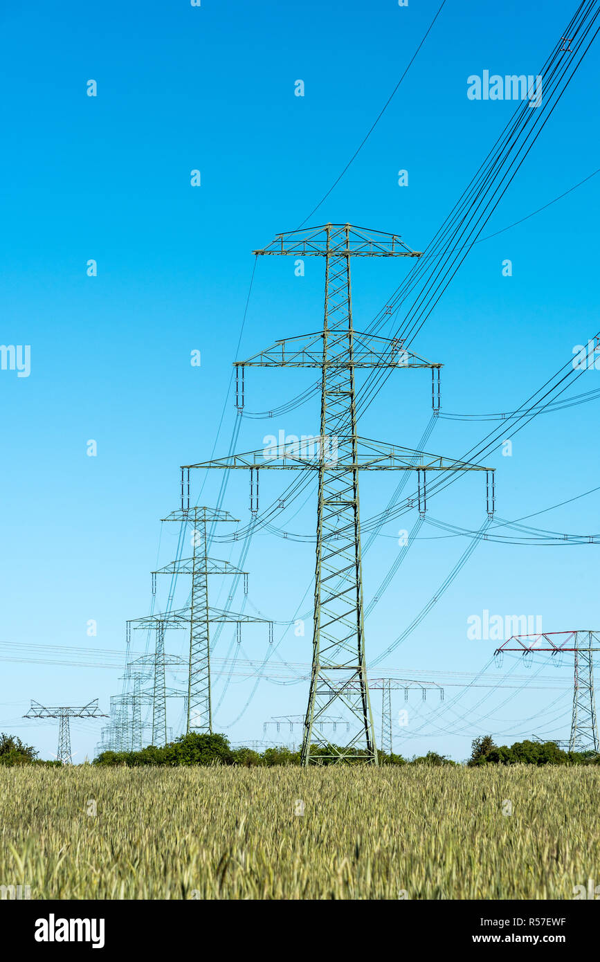 transmission towers with power lines in germany Stock Photo