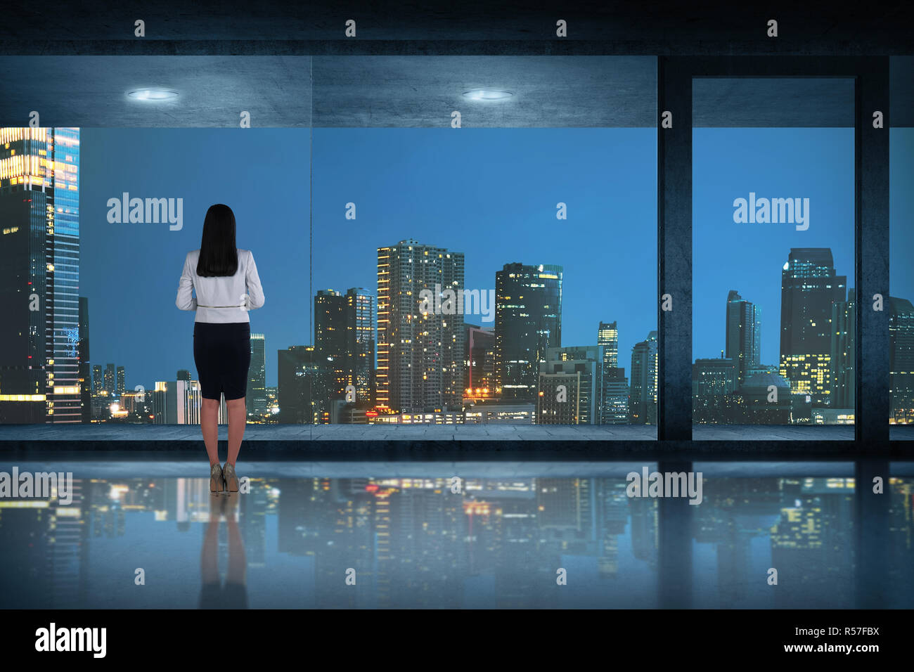 Back view of asian business woman standing looking at the city Stock ...