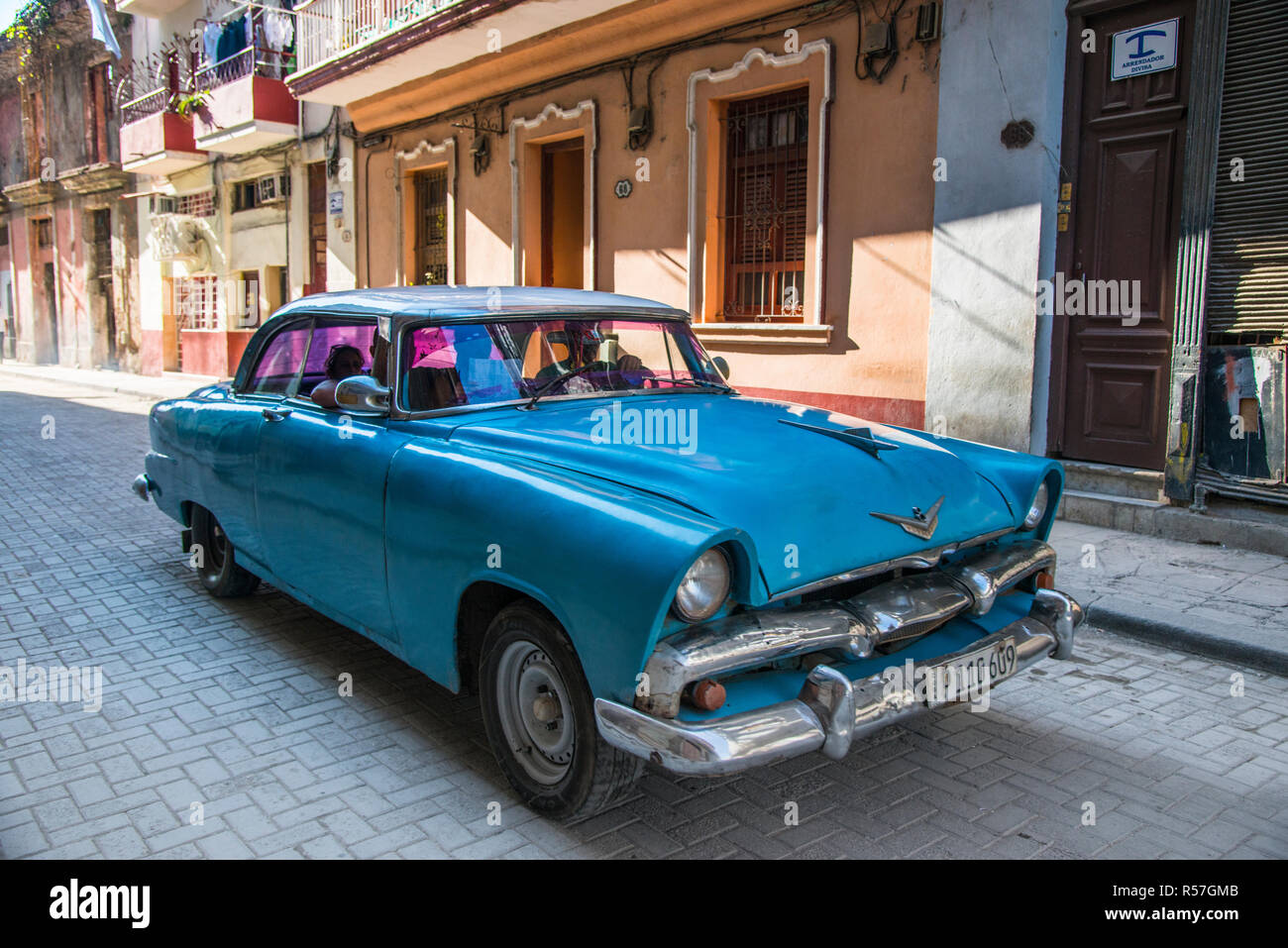 Classic blue 1950's car on a typical Havana street. Stock Photo