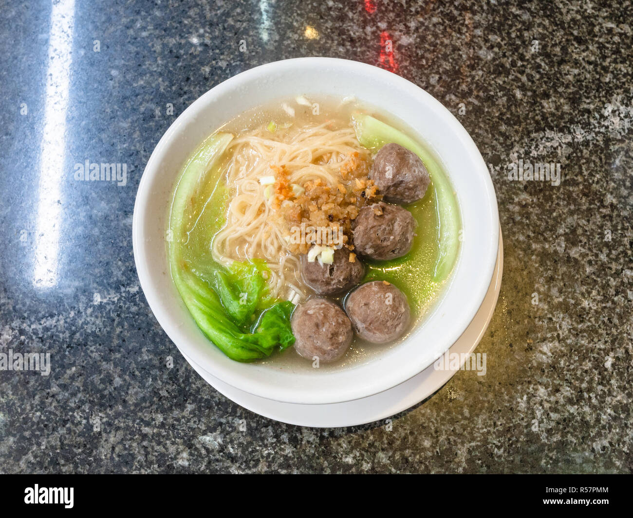 top view of meatballs with noodle soup in bowl Stock Photo