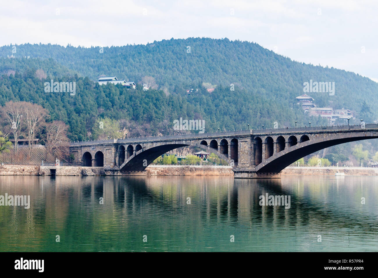 view of Longmen Bridge over Yi River in China Stock Photo