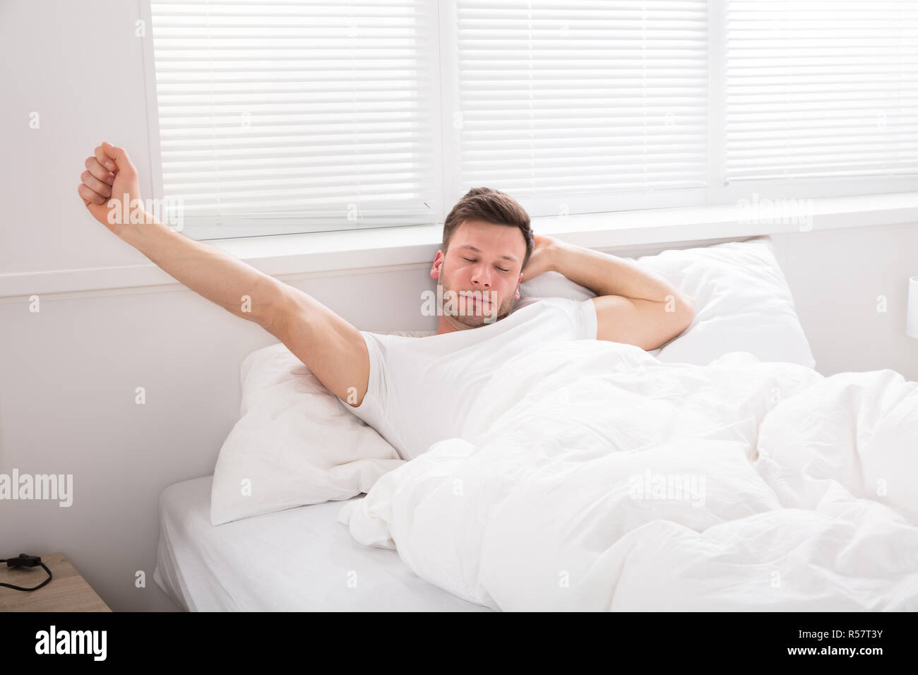 Man Stretch His Hand After Wake Up Stock Photo Alamy