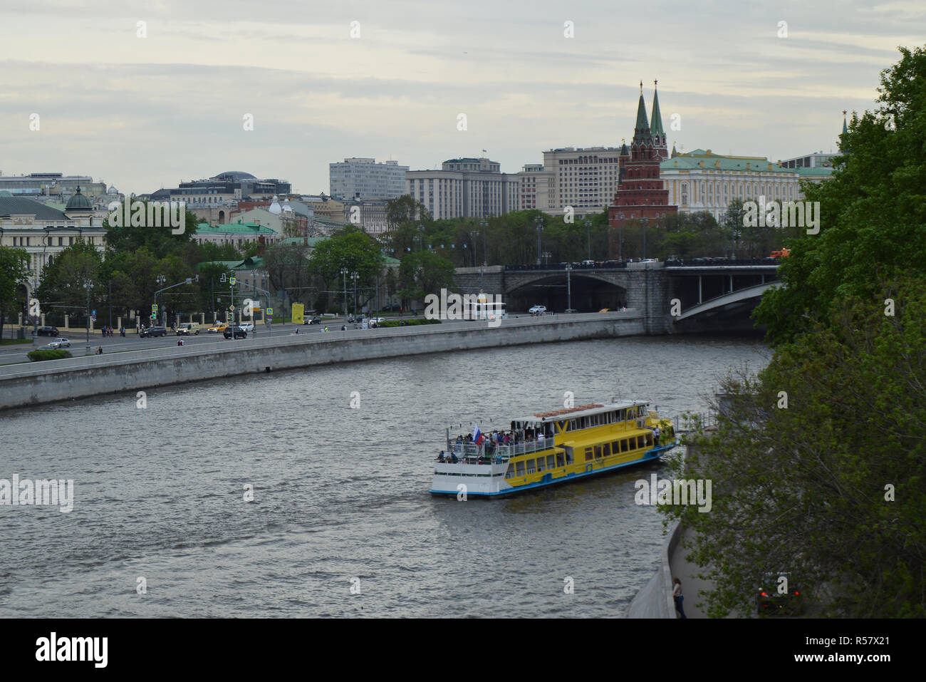 Russia Moscow 2016.05.20: Ship, boat on the Moscow river in the evening, on the background of the Kremlin Stock Photo