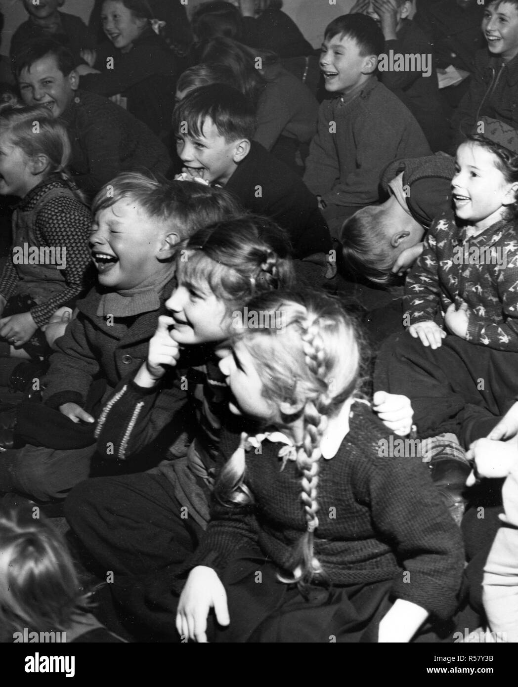 Original caption: 'Sweeney Steps Out.' Sweeney is the star of one of the many instructive and entertaining movie shorts the Linz, Upper Austria American House lends to volunteer operators who display them at rural schools and social centers. Stock Photo