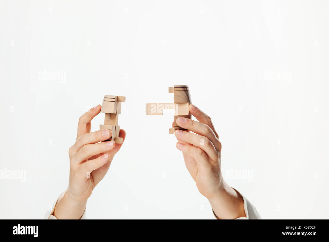 puzzle in hand isolated on white background Stock Photo - Alamy