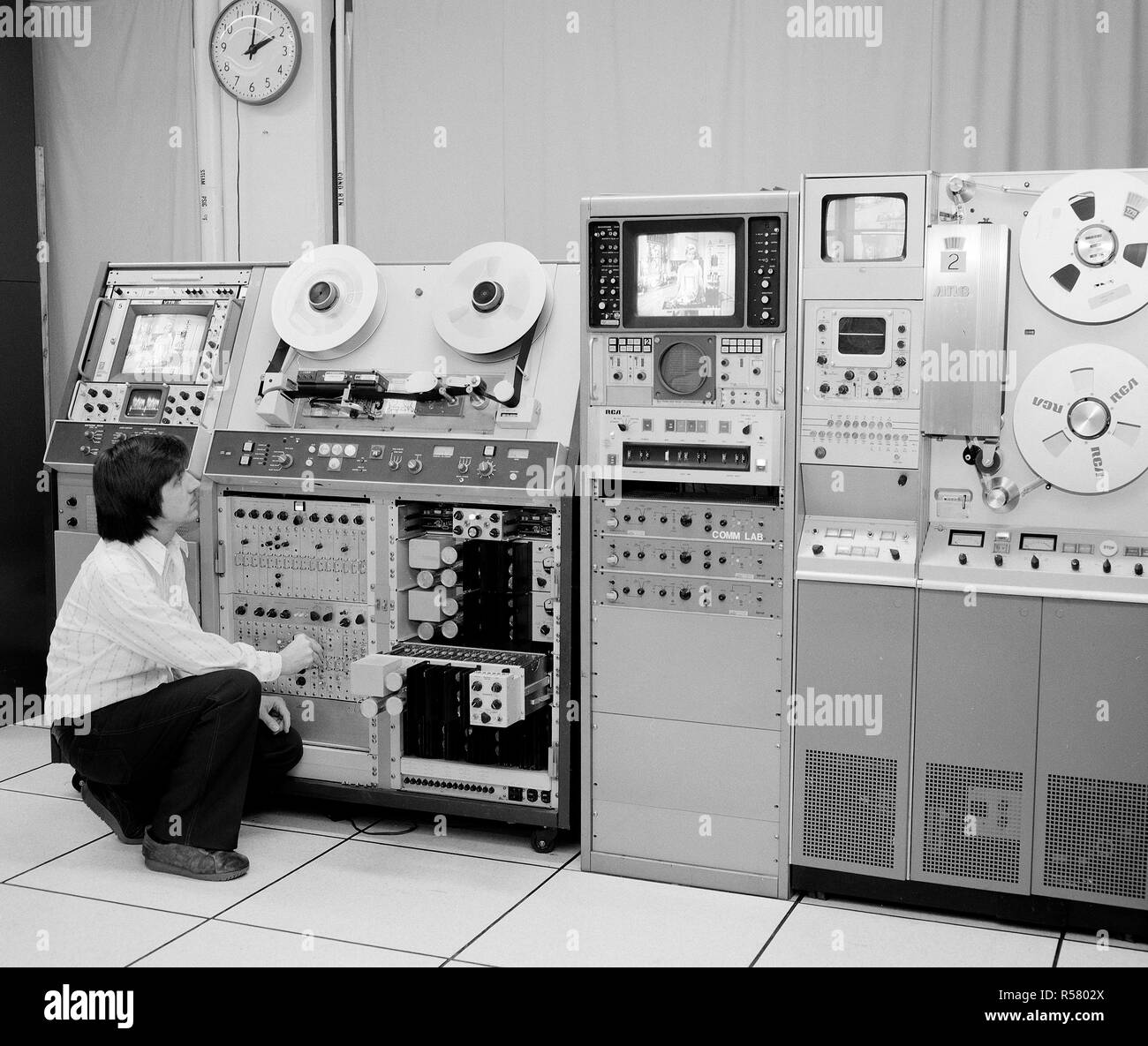 Worker with Television TV Tape machines and screens ca. 1979 Stock