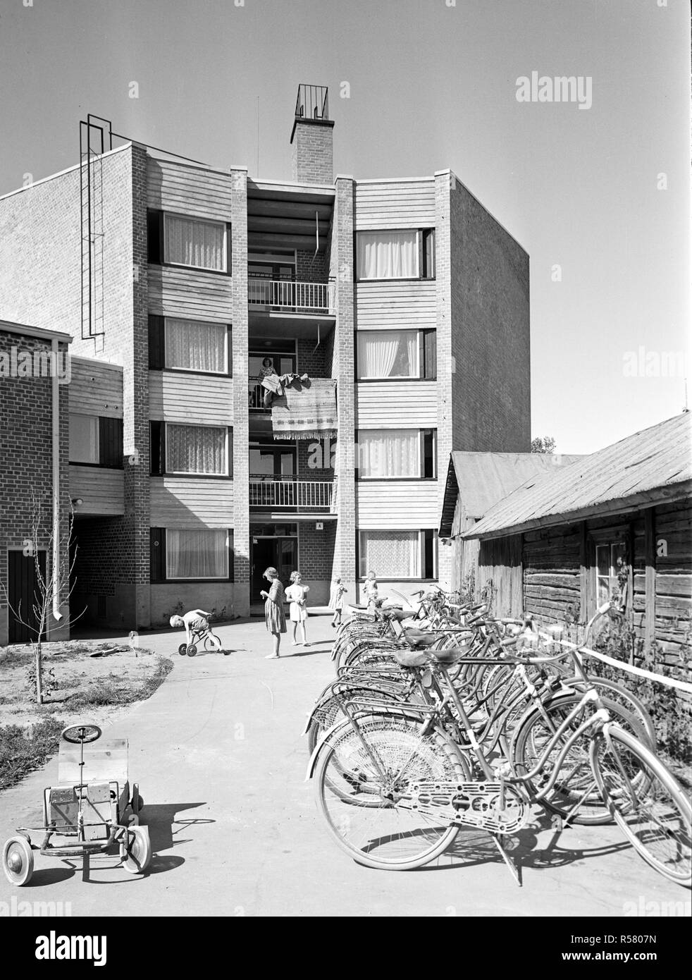 Finland History Apartment building with bicylcles parked and gocart