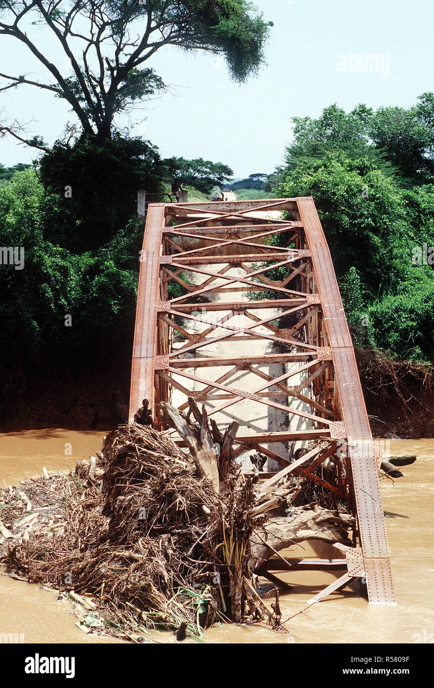 1993 - A destroyed bridge that spanned one of the rivers near Kismayo. Stock Photo