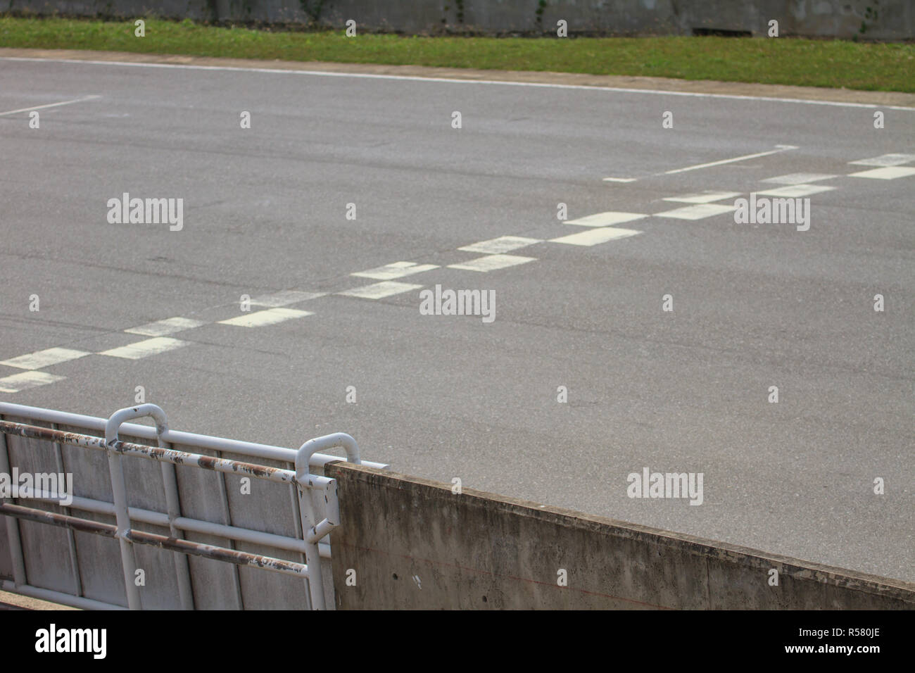 Start and Finish motor race line asphalt Stock Photo - Alamy
