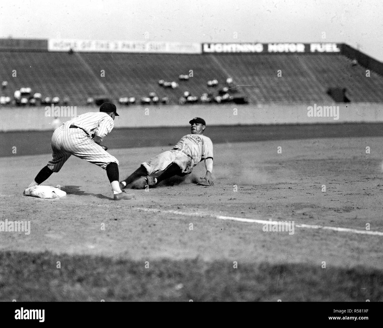 Photograph of Babe Ruth Sliding into Third Base ca. 1920 - 1934 Stock Photo