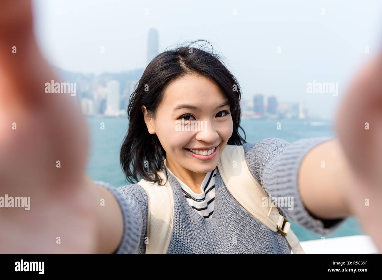 Woman take selfie image in Hong Kong Stock Photo - Alamy