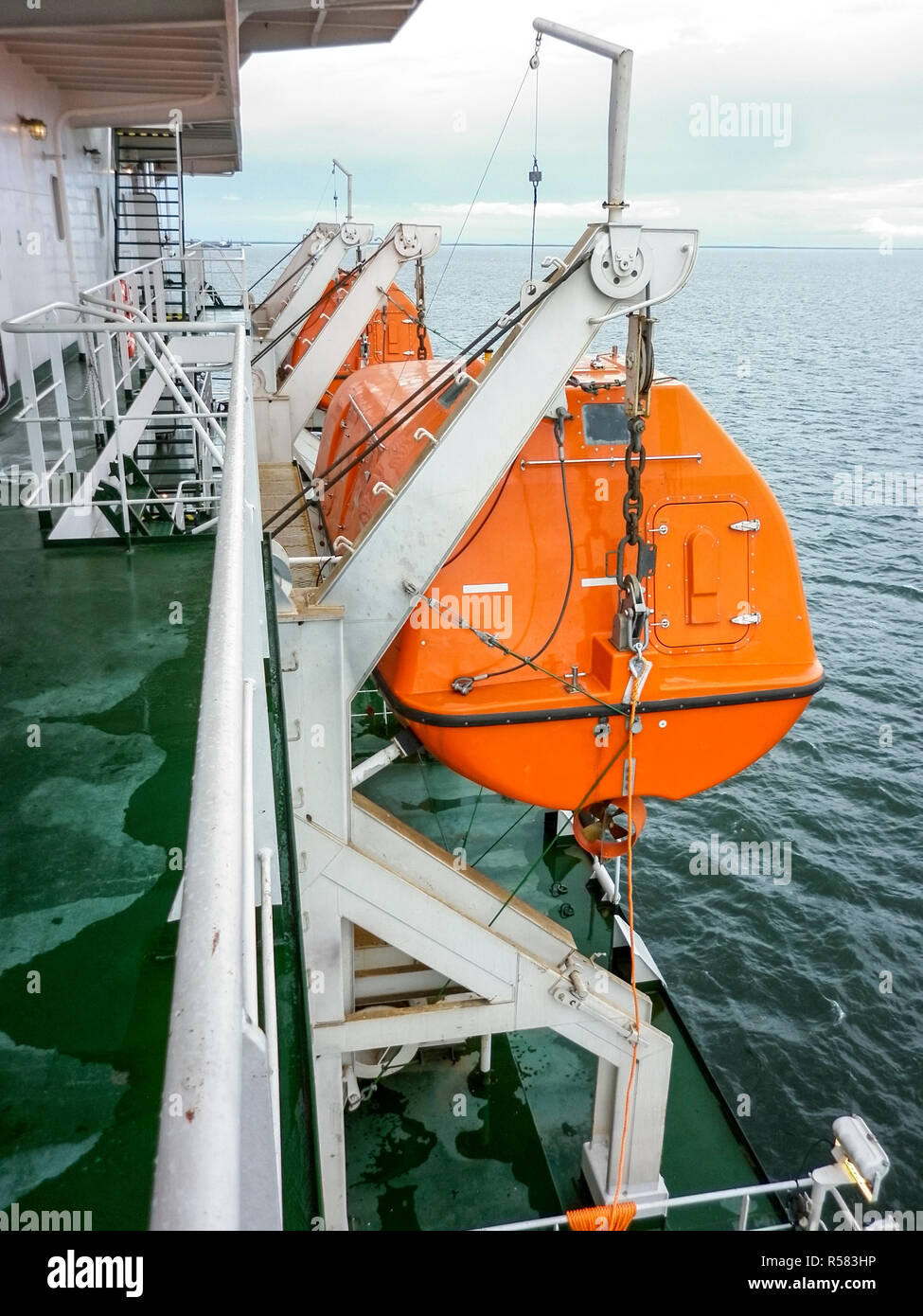 A lifeboat in case of an accident in the port or on a ship. The Stock Photo