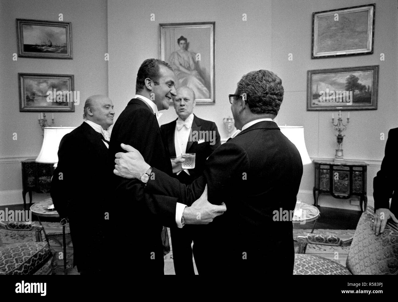 1976, June 2 – Second Floor - Yellow Oval Room – The White House – Gerald R. Ford, King Juan Carlos I, Henry Kissinger, José María de Areilza – standing, talking; formal wear Stock Photo