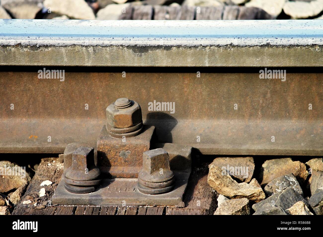 mounting screws on a railway track Stock Photo