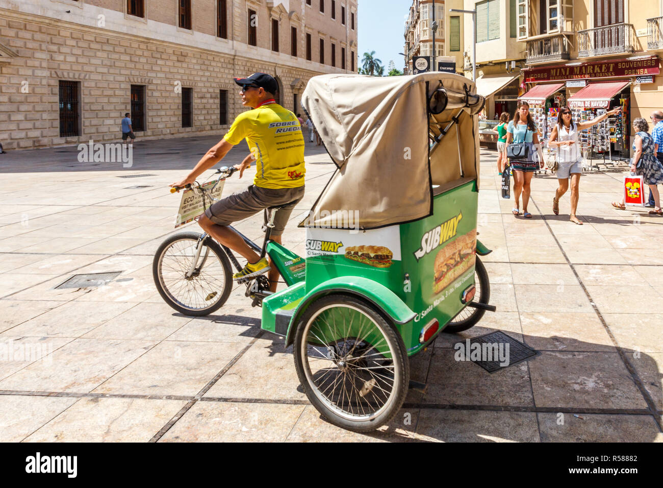 Malaga, Spain - 26th August 2015: A tricycle taxi looking for business. They take tourists on sightseeing trips around the city. Stock Photo